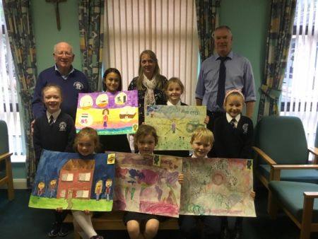 Congratulations to (front) Cheslie, Ashley, Pascal and (back) Aoife, Aliz, Aoife and Liepa who won prizes for their beautiful art work.  Also pictured are representatives from Omagh Credit Union with school Art Tutor, Mrs Sharyn Kelly, who runs the school's extra-curricular Arts & Crafts programme.